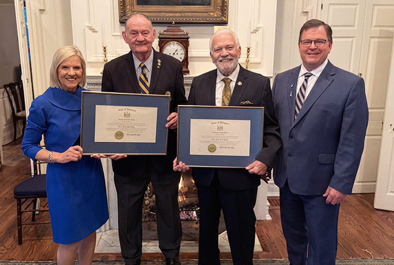 Delaware Gov. Bethany Hall Long presents the Order of the First State to Paul Davis and Dave Skocik for their commitment to veterans.