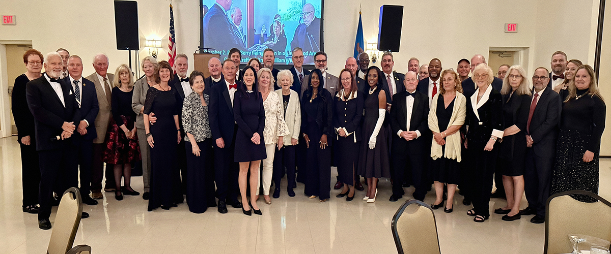Retired Delaware Army National Guard Maj. Gen. Hank McCann with veterans, elected officials and families at a Delaware Veterans fundraising gala at Dover's Modern Maturity Center.