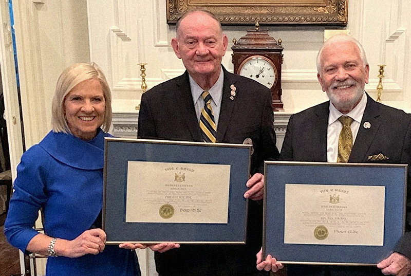 Delaware Gov. Bethany Hall Long presents the Order of the First State to Paul Davis and Dave Skocik for their commitment to veterans.